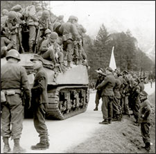German soldiers surrendering to Americans in tank, on the road into Berchtesgaden
