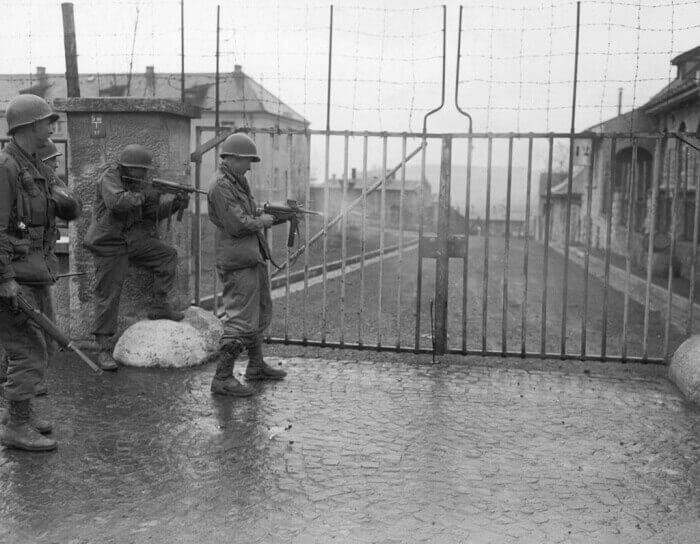 American soldiers shooting at the entrance to Stalag 13 POW camp
