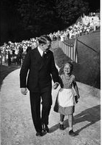 Hitler walking up the road near the Berghof with a little girl Hitler walking up the road near the Berghof with a little girl