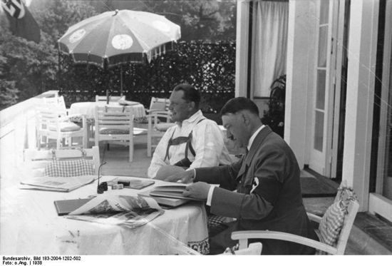 Hitler and Goering on terrace of Berghof, Hitler reading newpaper Hitler and Goering on terrace of Berghof, Hitler reading newpaper