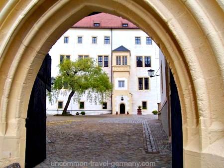 View of prisoners courtyard through archway, Colditz Castle