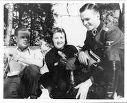 Eva Braun on Obersalzberg with two SS officers Eva Braun on Obersalzberg with two SS officers