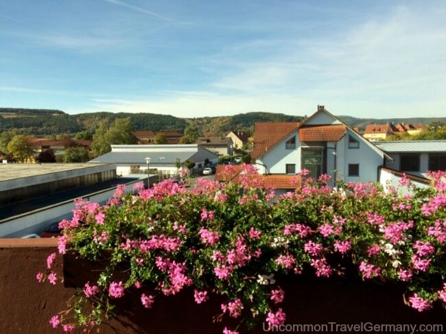 Flowered balcony and view from Hotel Kaiser in Hammelburg Germany
