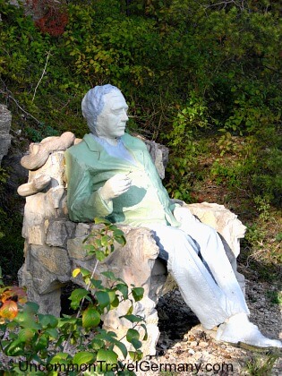Mysterious statue of seated man outside Hammelburg Mysterious statue of seated man outside Hammelburg