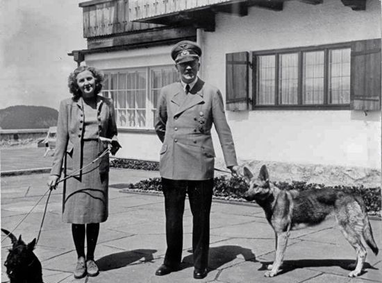 Hitler and Eva Braun on Berghof terrace with dogs Hitler and Eva Braun on Berghof terrace with dogs