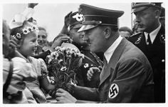 Hitler receiving flowers from little girl Hitler receiving flowers from little girl