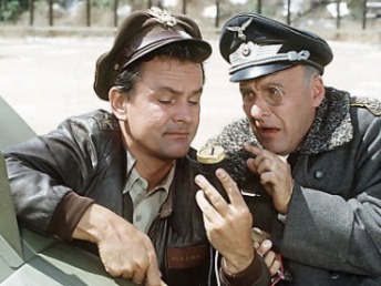 Colonel Hogan diffuses bomb with Colonel Klink