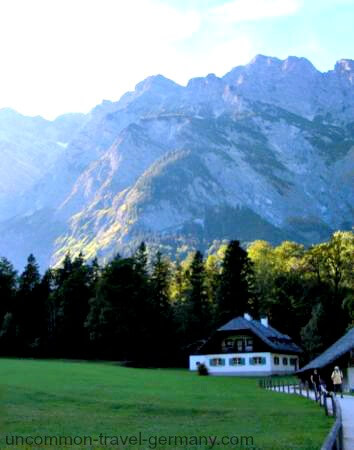Alpine house and mountains at Lake Konigssee