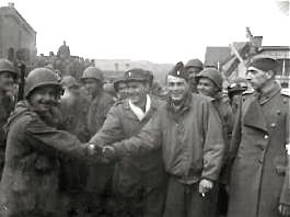 Freed American POW shaking hands, Stalag 13, 1945